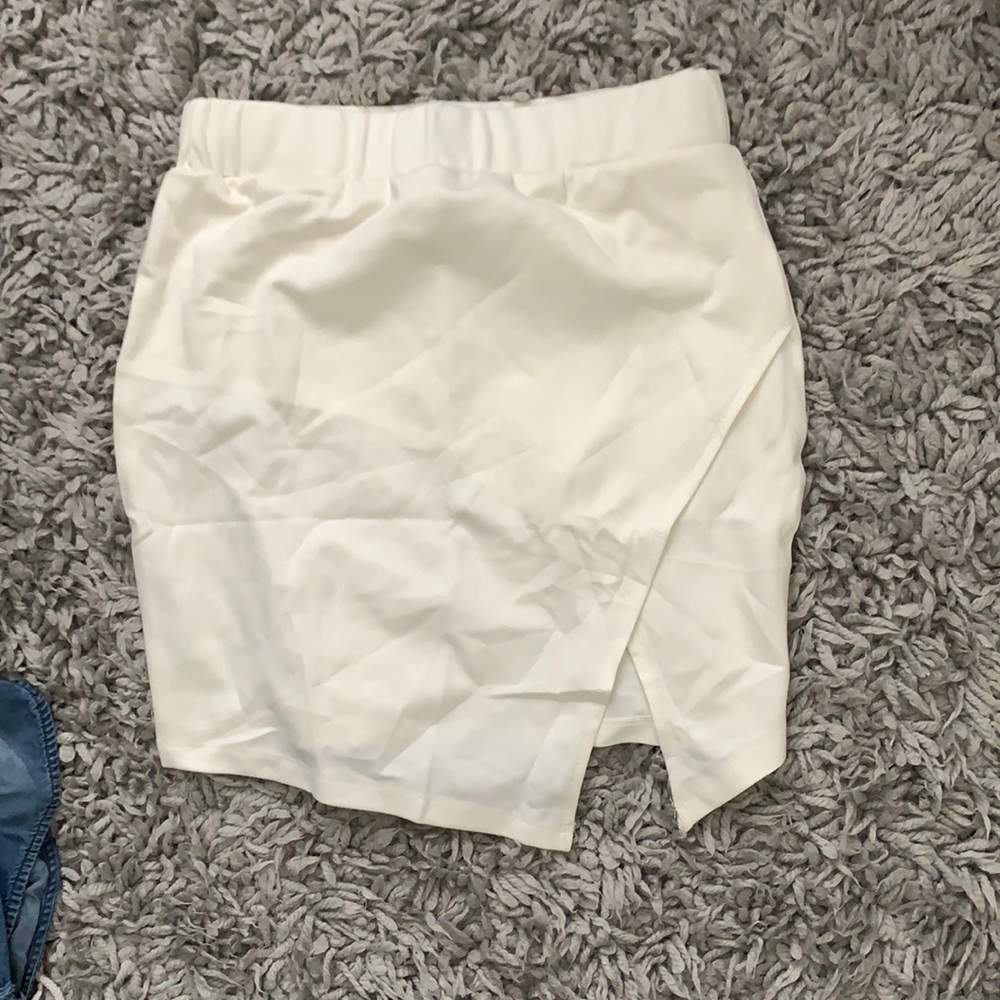 creams colored skirt with cut out